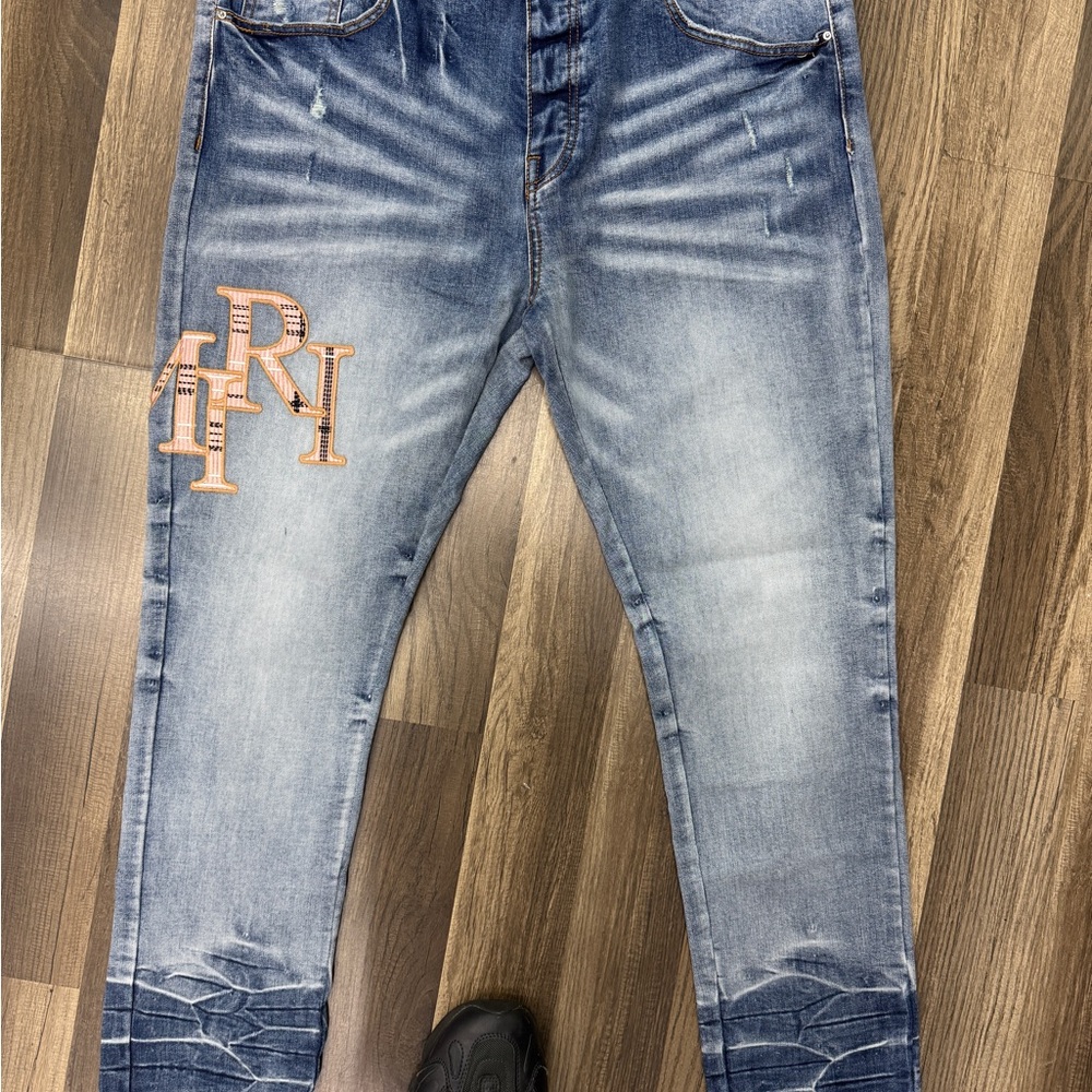 AMIRI Blue Skinny Jeans with Distressed Details